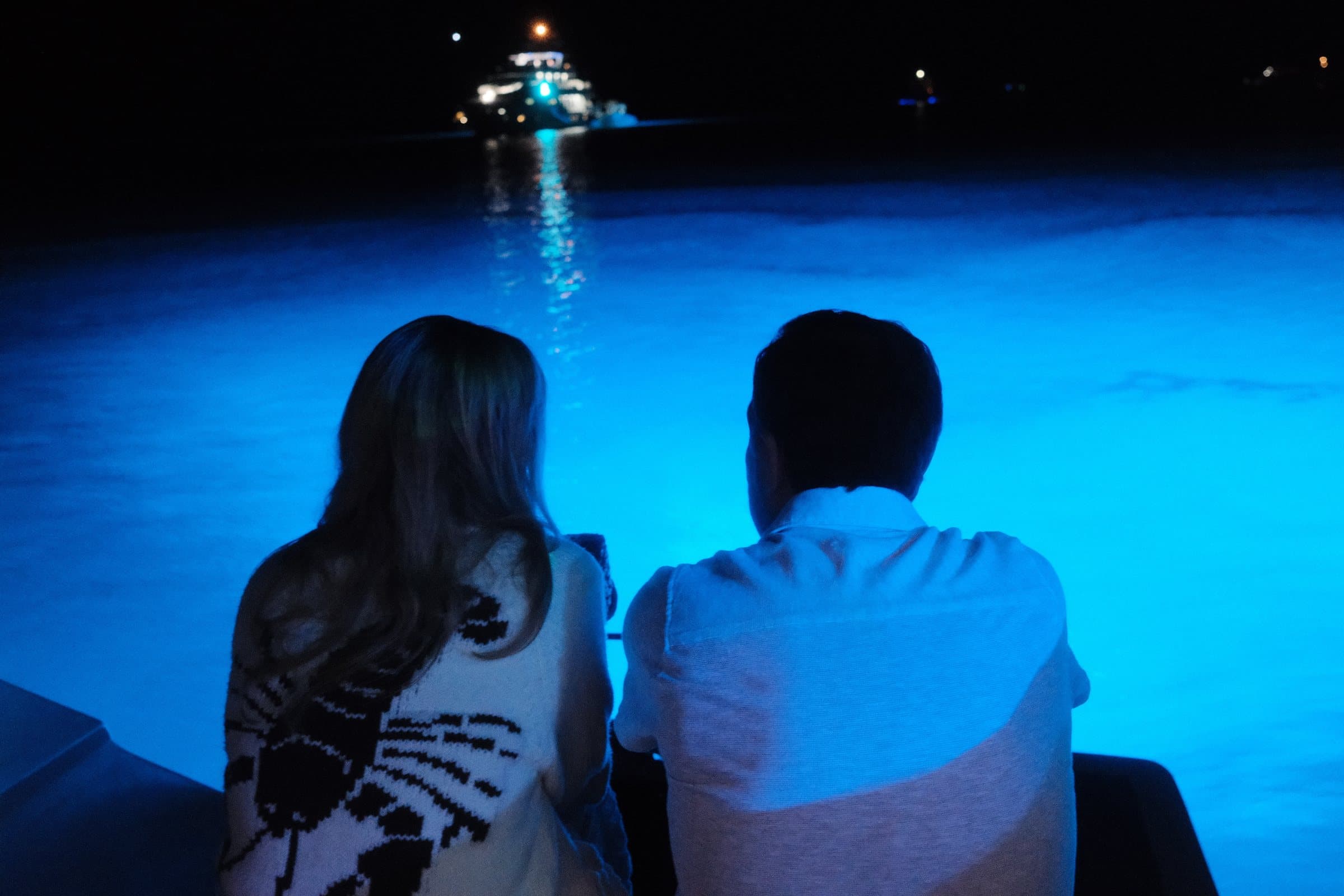 Guests viewing blue underwater lights at night