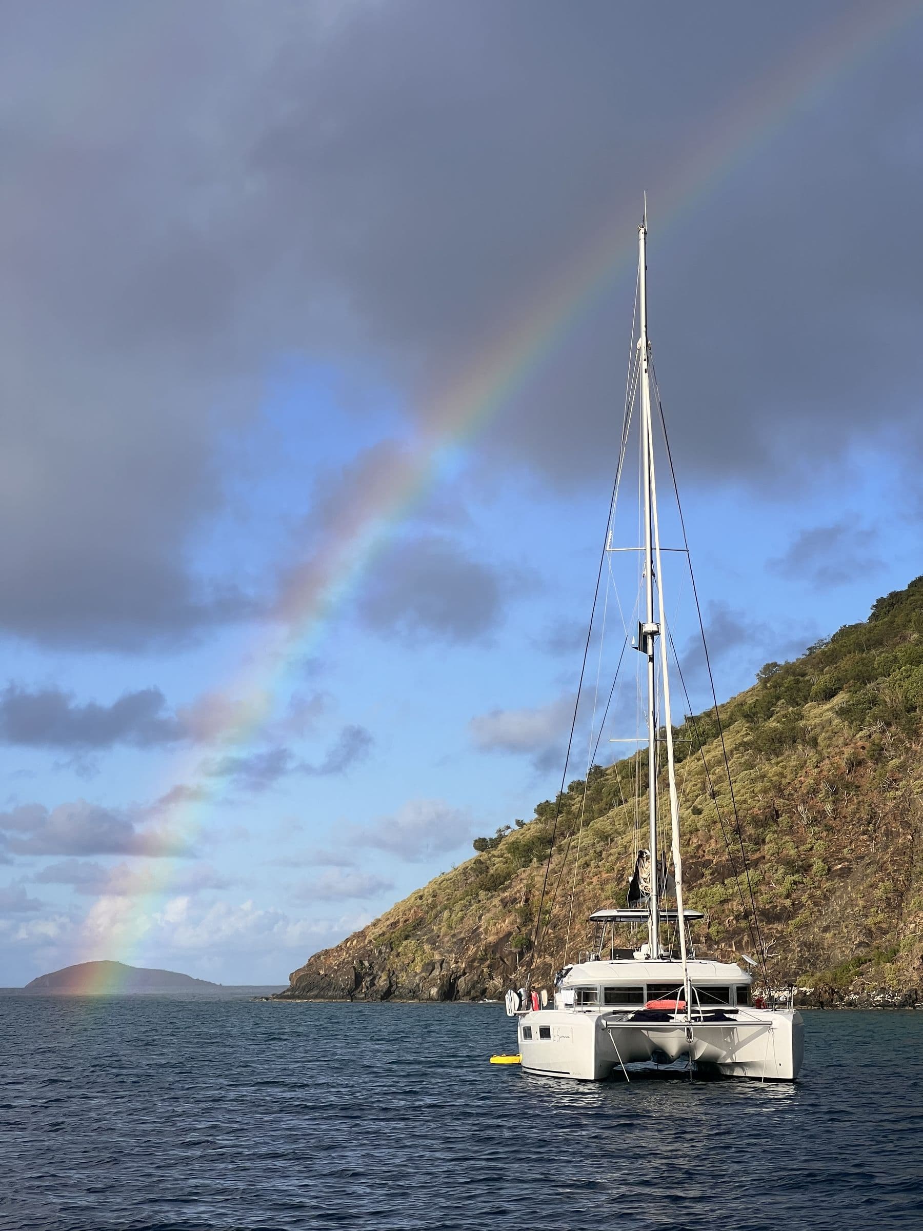 Catamaran with double rainbow — Exumas