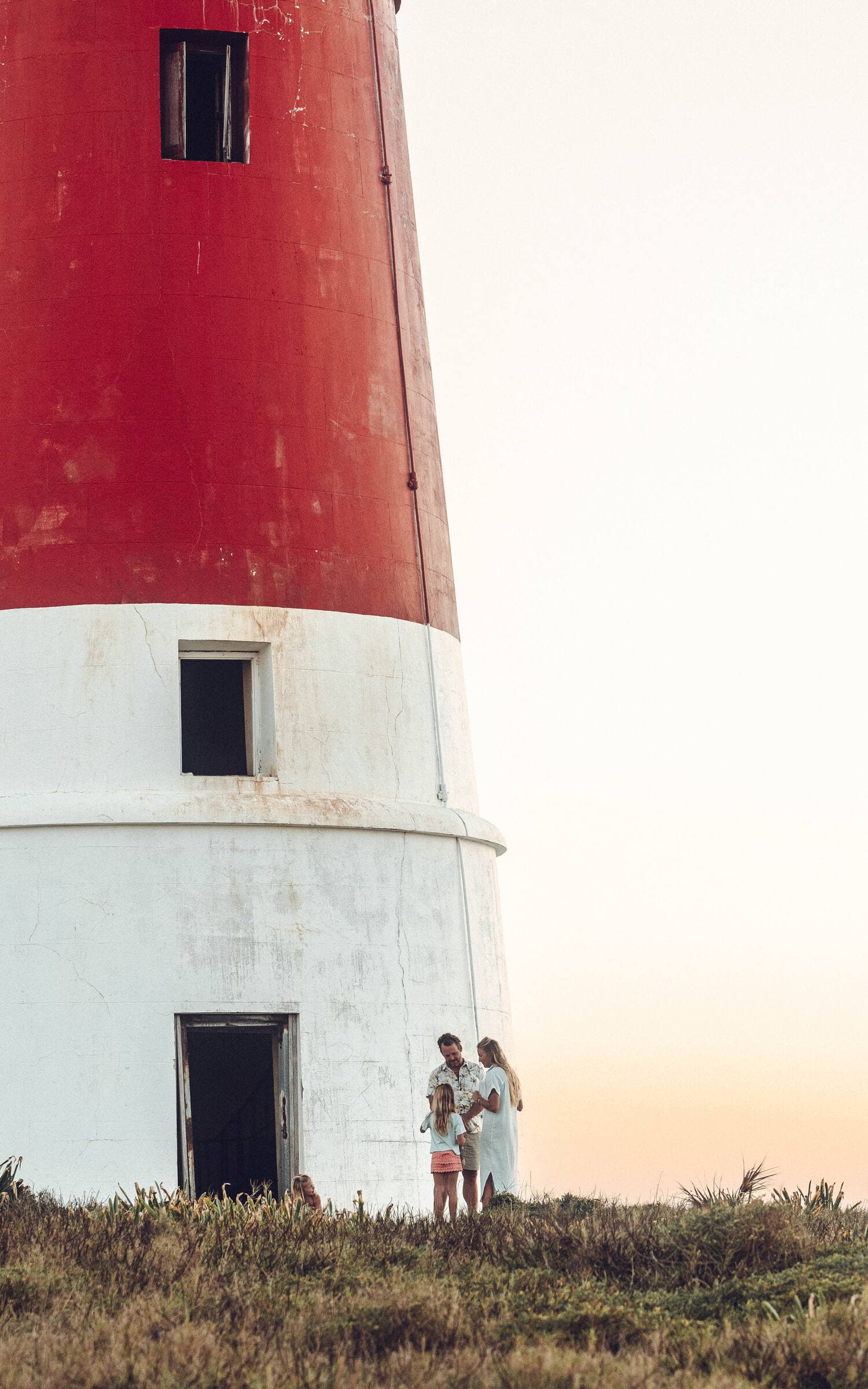 Family at lighthouse — golden hour, Bahamas